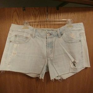 Light denim distressed shorts